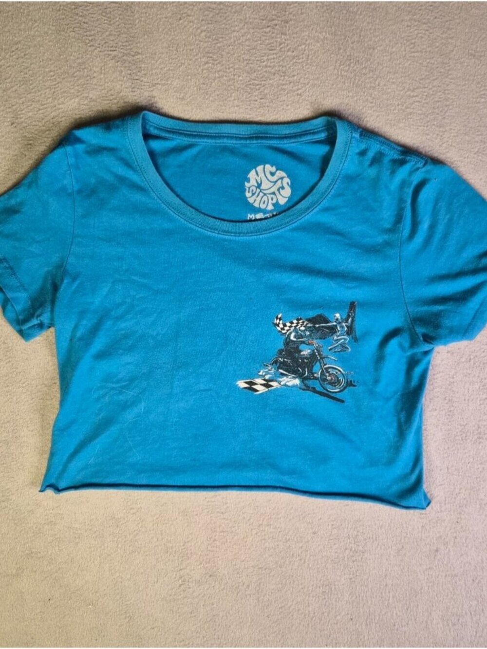 Blue cropped tee with graphic design. Size: M #
